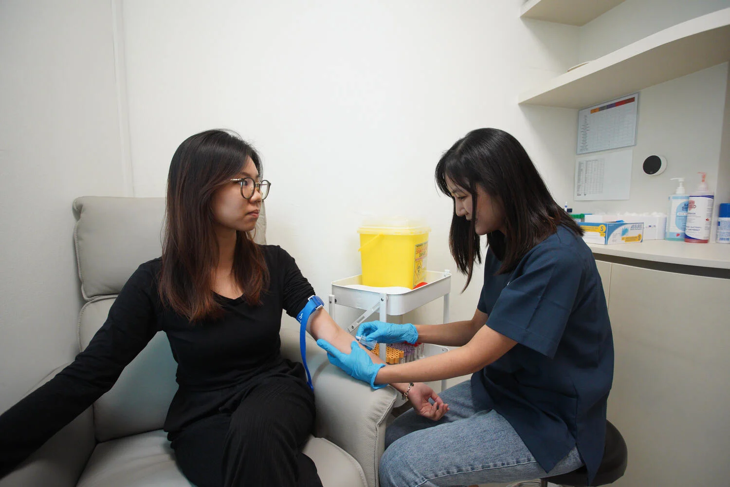 Blood sample being collected for a lipoprotein(a) (Lp(a)) test at a Singapore cardiology clinic